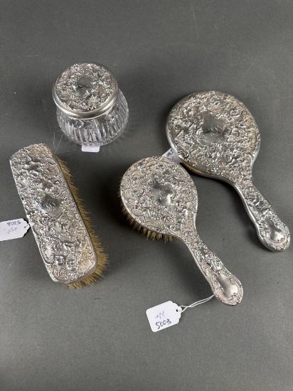 Victorian sterling dresser set heavily embossed with cherubs