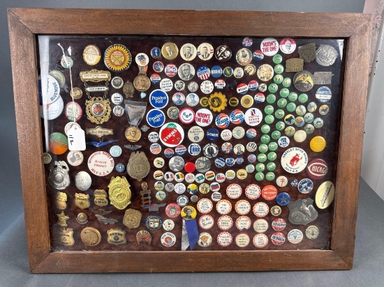 Framed collection of over 100 old badges, political buttons etc
