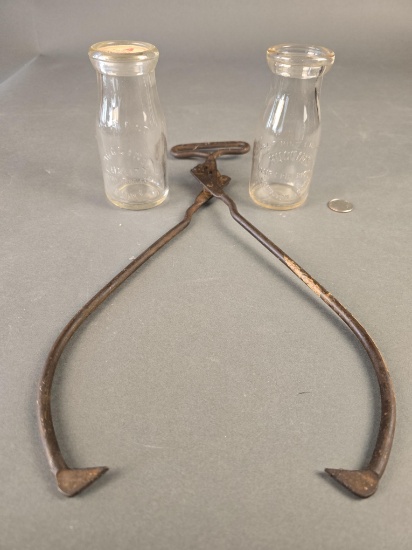 2 early Lewiston embossed Huggins Dairy bottles and a Huggins ice tongs