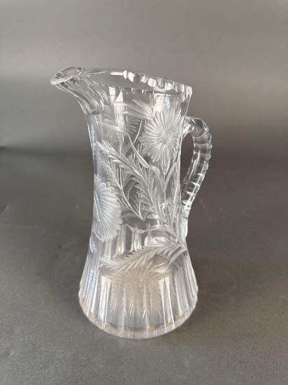 Brillant period cut Glass pitcher with an engraved Native man