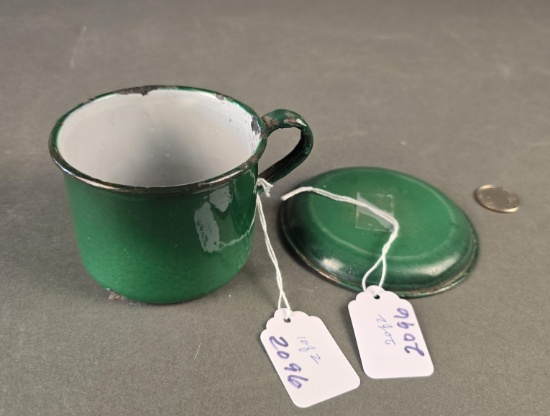 Green banded cup and advertising saucer