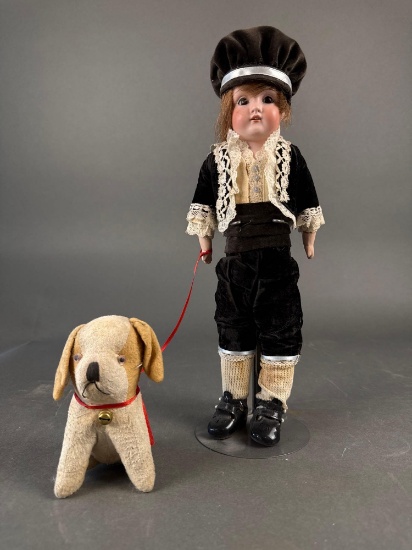 Bisque boy doll with his dog, doll marked 154 dep