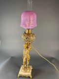 Standing Cherub Cranberry table lamp