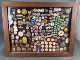 Framed collection of over 100 old badges, political buttons etc
