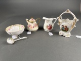 4 floral pitchers and bowls