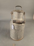 Vintage metal cream can with wooden handle