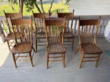Set of 9 press back wooden matching dining chairs,