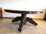Massive, heavily carved oak dinning table with leaves