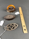 Child's toy sad iron and trivet and extra iron