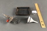 Child's cooking pan with funnel and egg beater