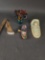 Native in board, canoe, kaya doll