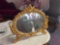 Oval cherub beveled mirror,