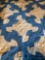 Blue and white quilt made by Mrs Cooper