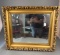 Mirror in heavy gold frame