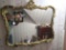 Large gold framed styled mirror