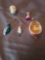 (5) ornaments (3) Santas, a fish and a paper/glass one