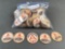 Sack of Huggins paper milk bottle tops, maybe 50 tops