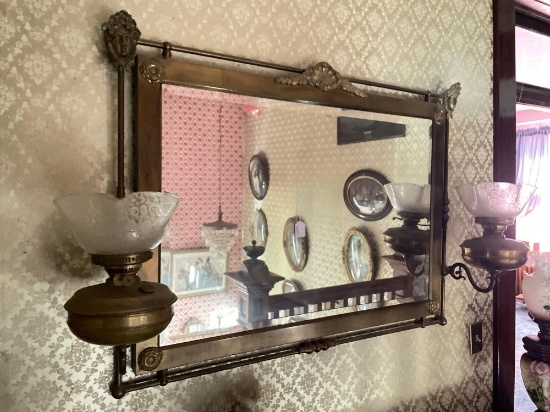 Large brass mirror with kerosene lamps attached to both sides