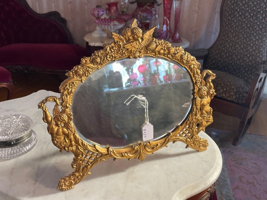 Oval cherub beveled mirror,