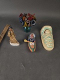 Native in board, canoe, kaya doll