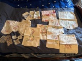 Bag of embroidered tea towels and misc. one week all matching towels