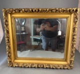 Mirror in heavy gold frame
