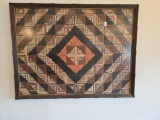 Quilt in frame, log cabin