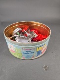 Marshmallow tin full of vintage cookie cutters