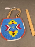 Double sided beaded bag pinocchio and geometric