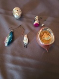 (5) ornaments (3) Santas, a fish and a paper/glass one