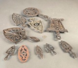 (10) Cast iron trivets. Doll size to adult trivets