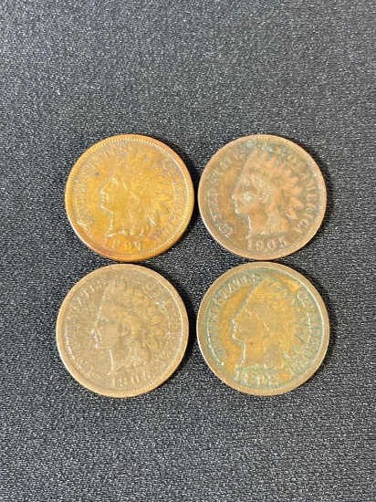 four Indian Head pennies, a one-cent coin produced by the U.S. Mint from 1859 to 1909