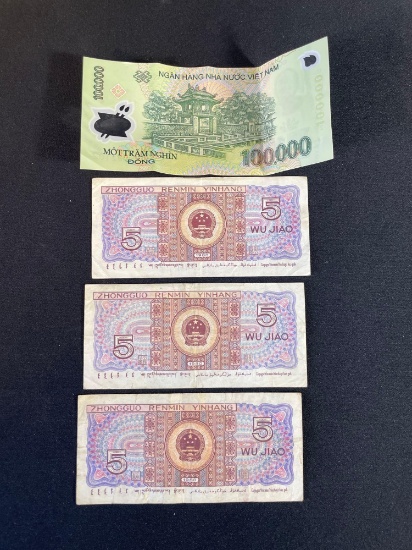 Vietnamese 100,000 Dong banknote and three Chinese 5 Wu Jiao banknotes from 1980