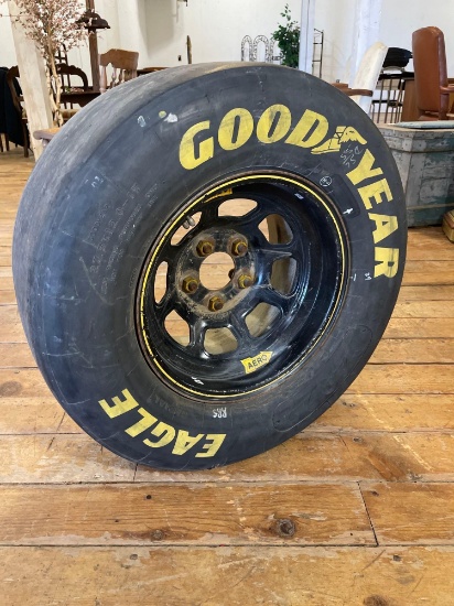 Goodyear Eagle Sports Car Radial slick racing tire with yellow lettering No 8 on Rim