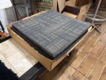 stack of modular commercial-grade carpet tiles