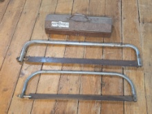 Proto Tools metal toolbox accompanied by two bow saws