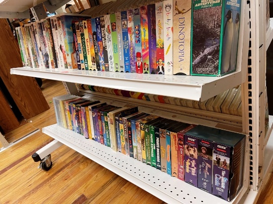 Two Shelves Of VHS Movie Tapes