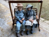 Porcelain Dolls on a Porch Swing