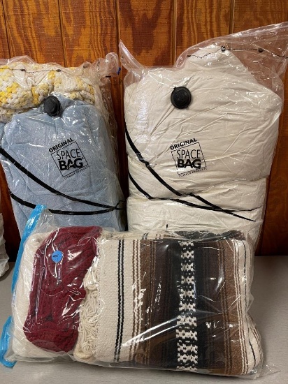 Several Blankets in vac space bags