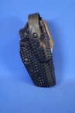 Safariland Level III Mid-Ride Holster.