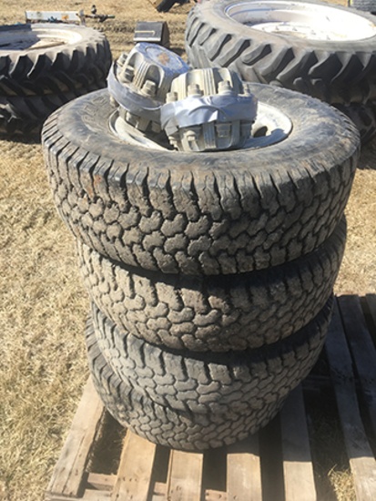 Set of 4 245-75-16 Tires, Wheels, & Chevy Caps