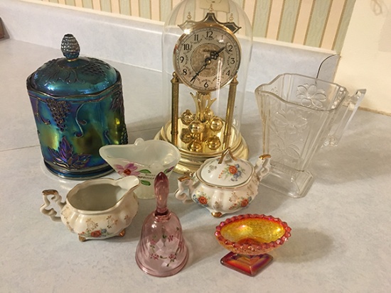 Anniversary clock and collectible dishes