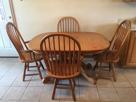Oakwood Industry 54 in. long x 42 in. wide table with 4 swivel captain chairs, has (2) 12 in. leaves