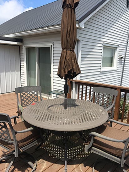 54 in. iron patio table with 4 chairs and umbrella