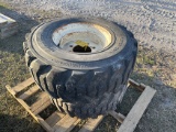 Lot of 2, 12-16.5, 8 bolt skid steer tires