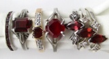 7-STERLING RINGS WITH RED GEMS.