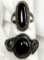 TWO SILVER RINGS WITH BLACK STONES