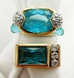 TWO STERLING RINGS WITH LIGHT BLUE STONES