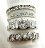 FOUR SHINY STERLING RINGS SIZES 5-8
