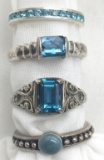 4-STERLING RINGS WITH BLUE STONE ACCENTS